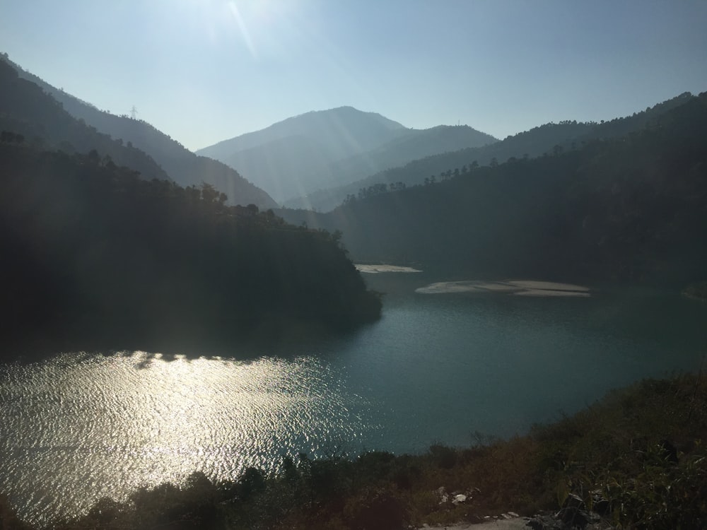 body of water across mountains photo