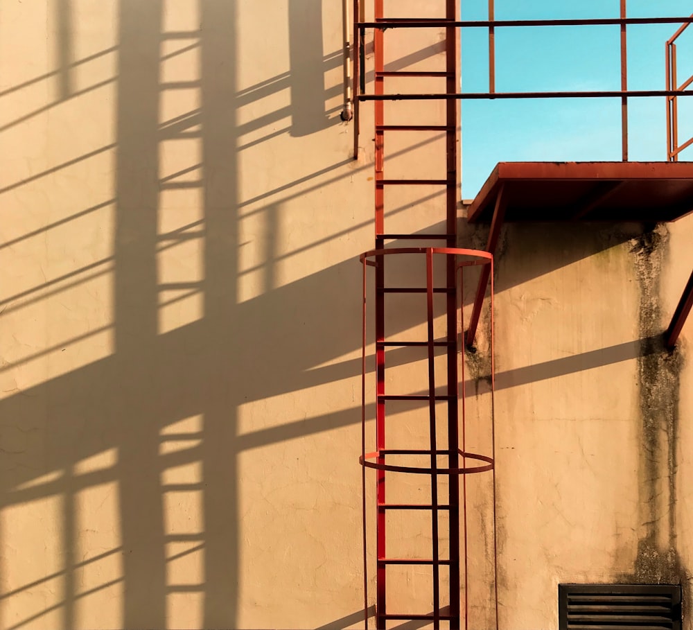 red ladder on wall