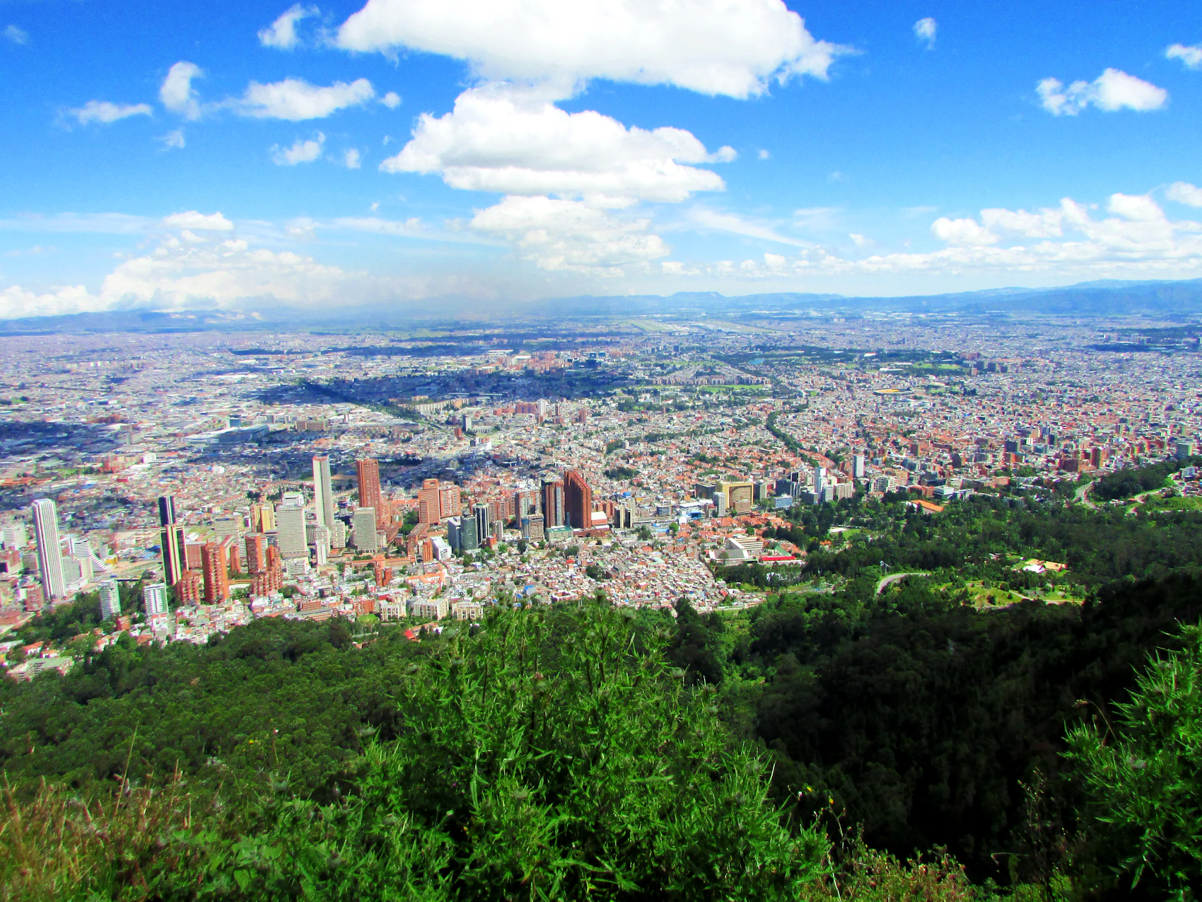 Bogotá spread beneath blue sky from the Monserrate hillside