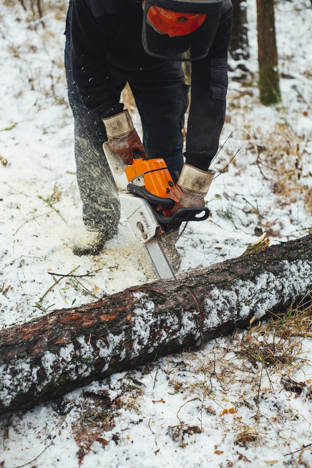 white and orange chainsaw