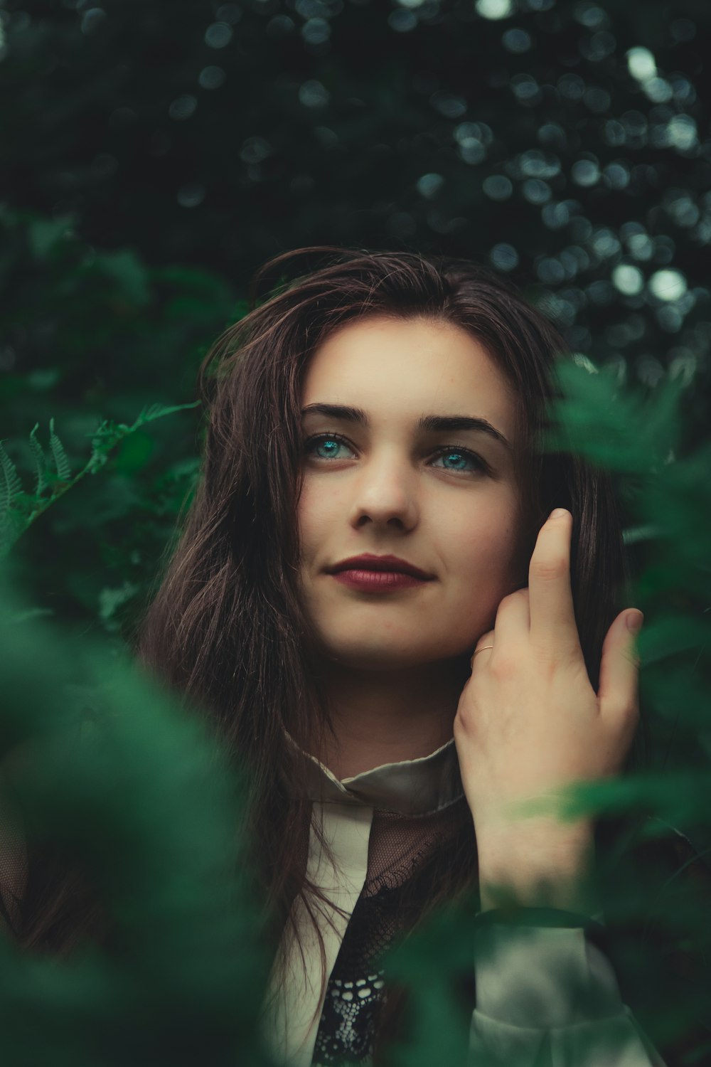 shallow focus photo of woman in brown top