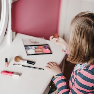 girl sitting in front of white table