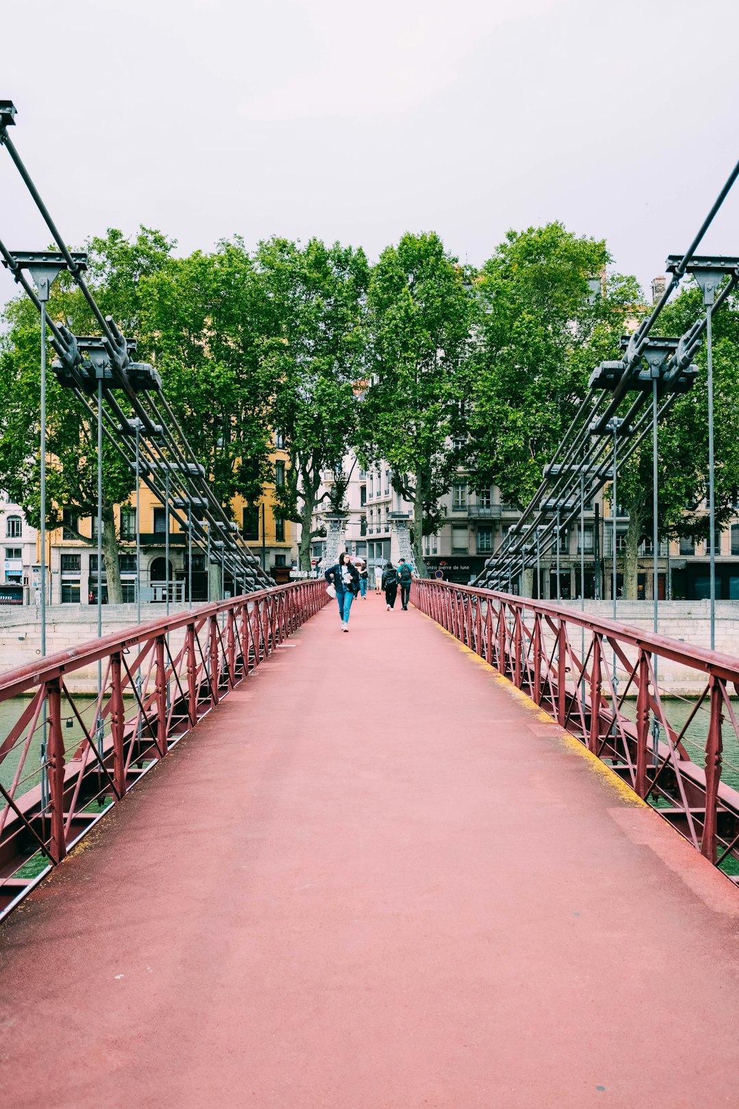 people walking on bridge