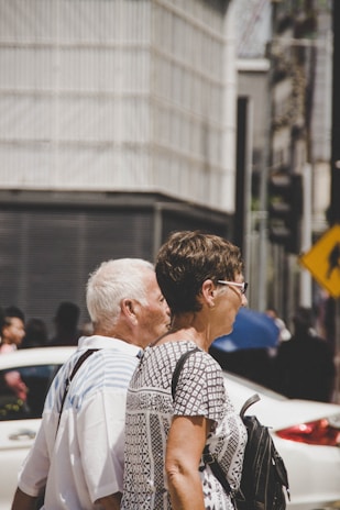 man and woman standing next to each other