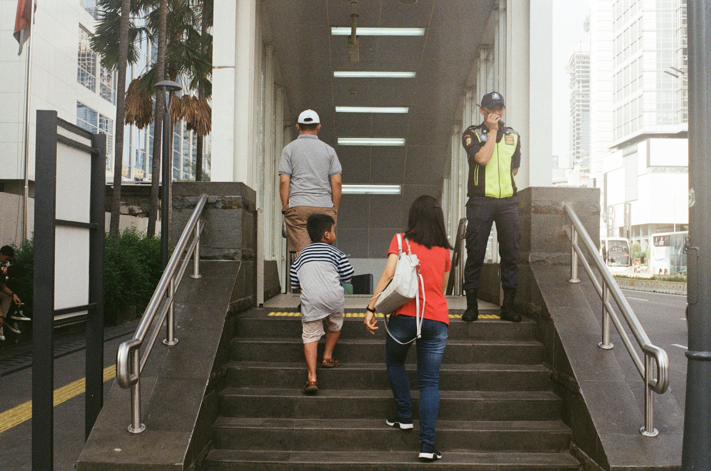 people walking on stairs (Photo by Izzati Al Basori on Unsplash)
