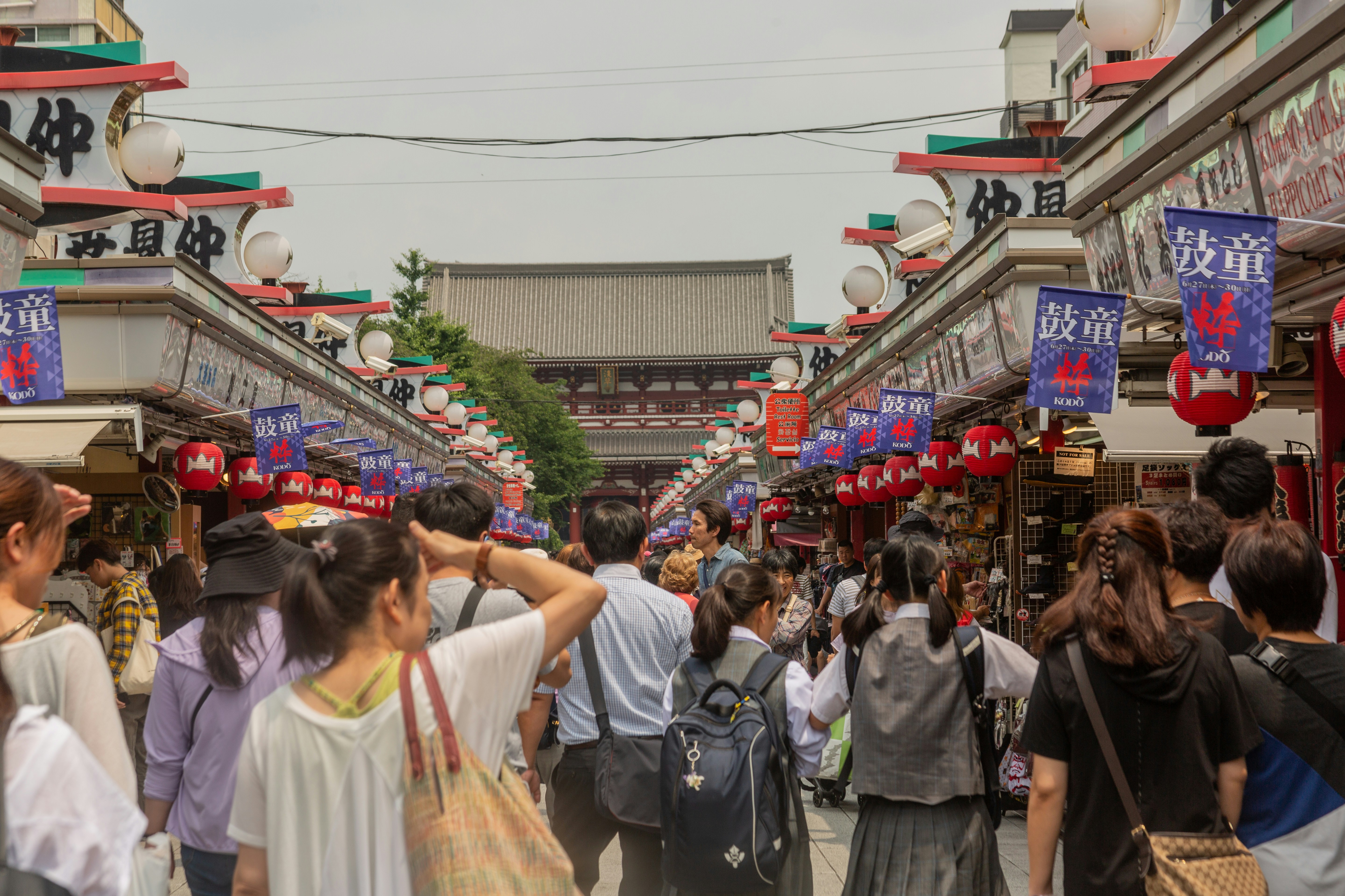 people in a market during daytime