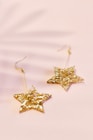 pair of gold-colored star earrings