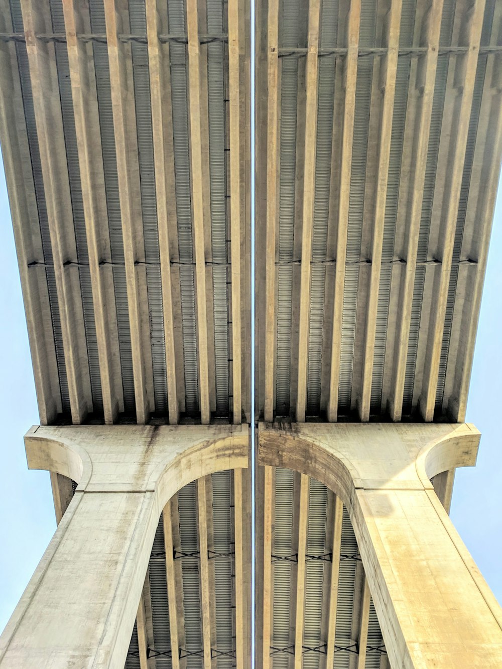 close-up photography of brown concrete bridge during daytime