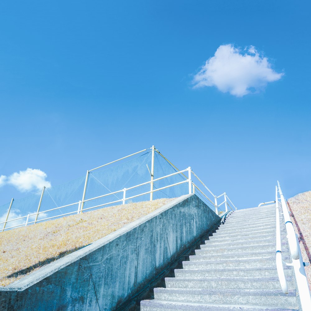 a man riding a skateboard down the side of a set of stairs