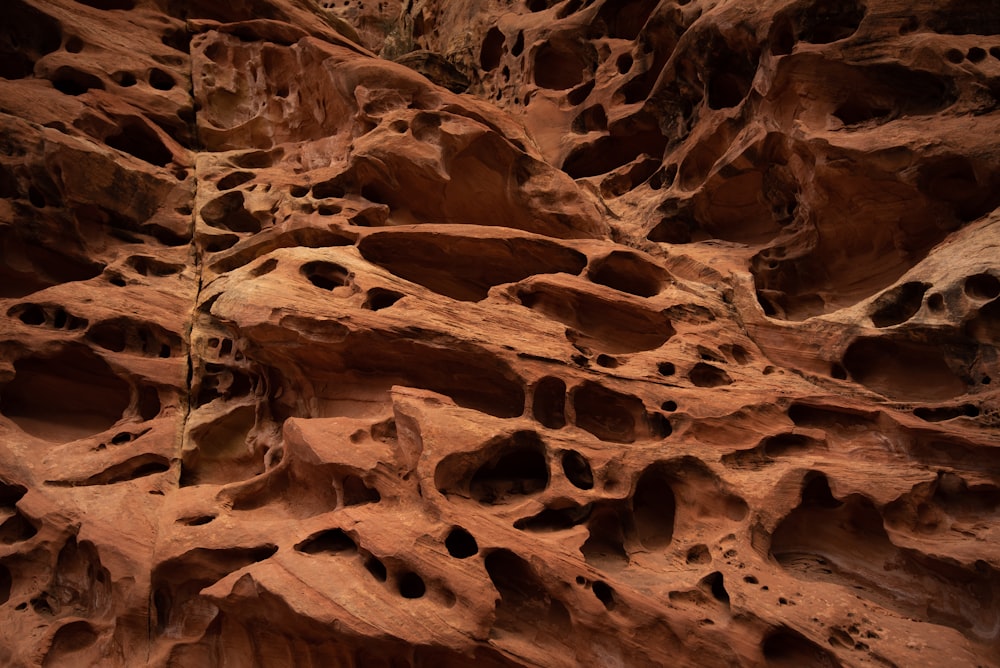 a large rock formation with holes in it