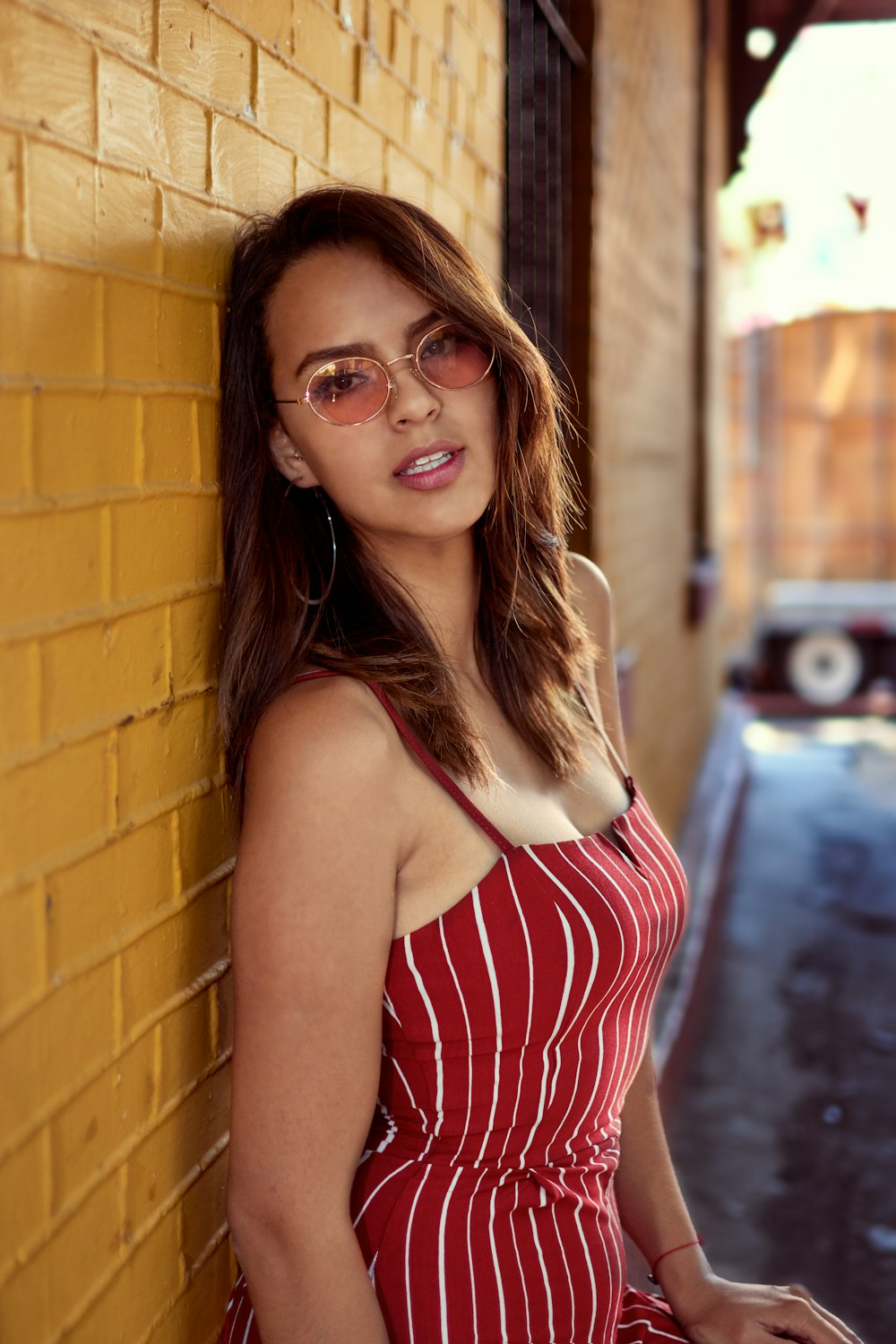 woman leaning on wall