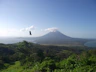The volcanic landscape and lush greenery of Ometepe Island seen from a lookout.