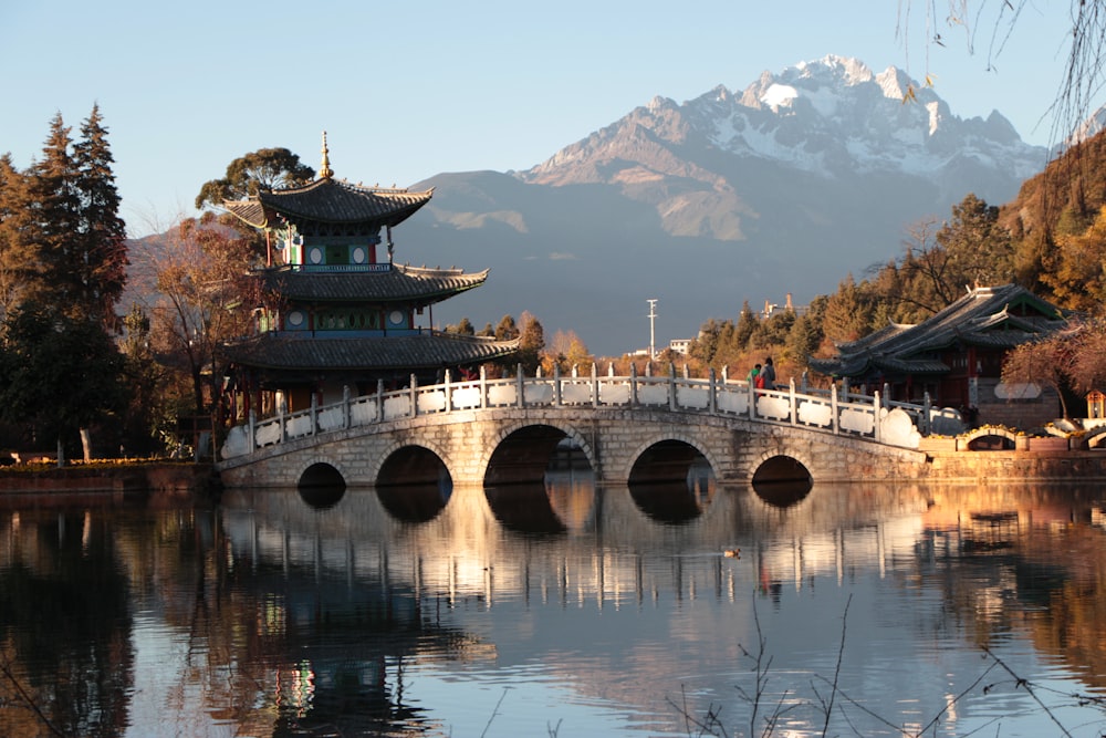 grey concrete bridge tower temple during daytime