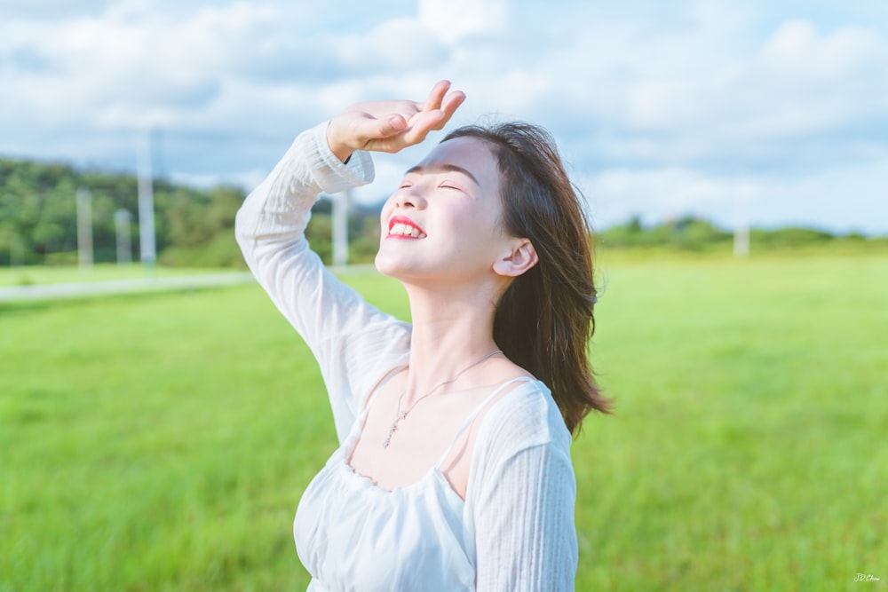 smiling woman wearing white dres