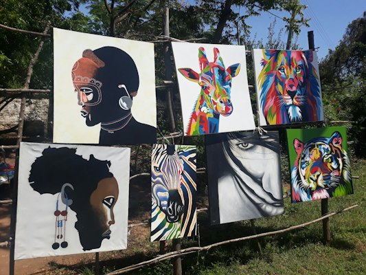 Paintings on fence — Diani Beach, Kenya