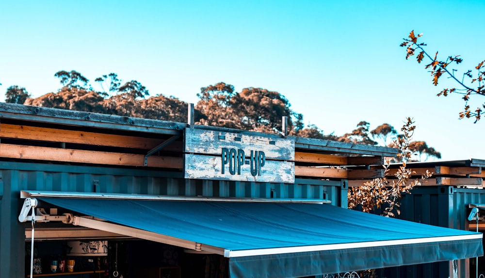 blue and brown wooden store during daytime