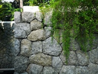 A sturdy, beautifully crafted retaining wall blending naturally with the garden landscape.