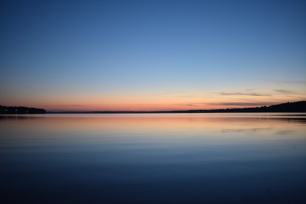 body of water during golden hour