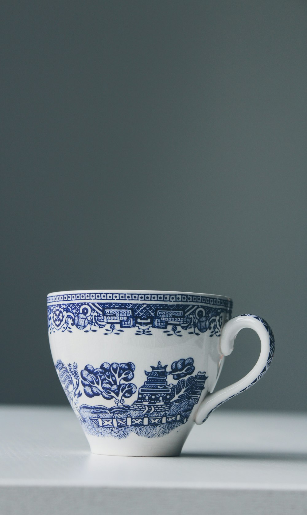 white and blue teacup