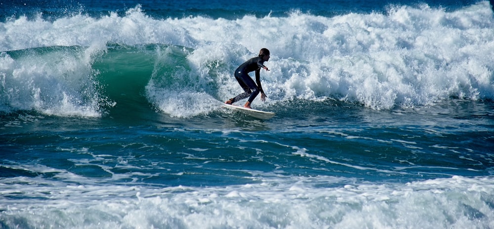 person riding on surfboard