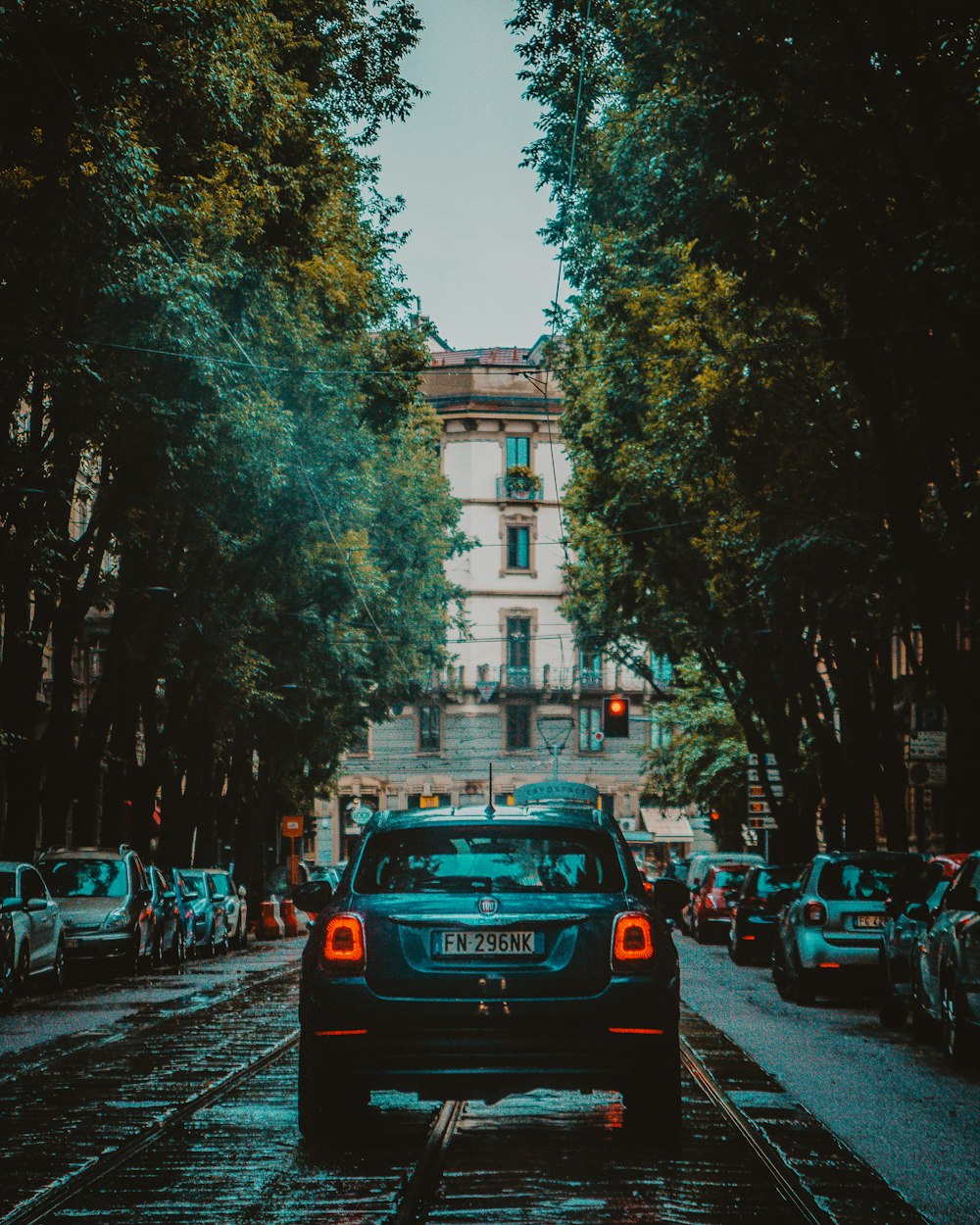 black vehicle near trees