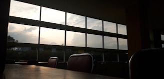Window view showing natural light flooding into the calm therapy office space