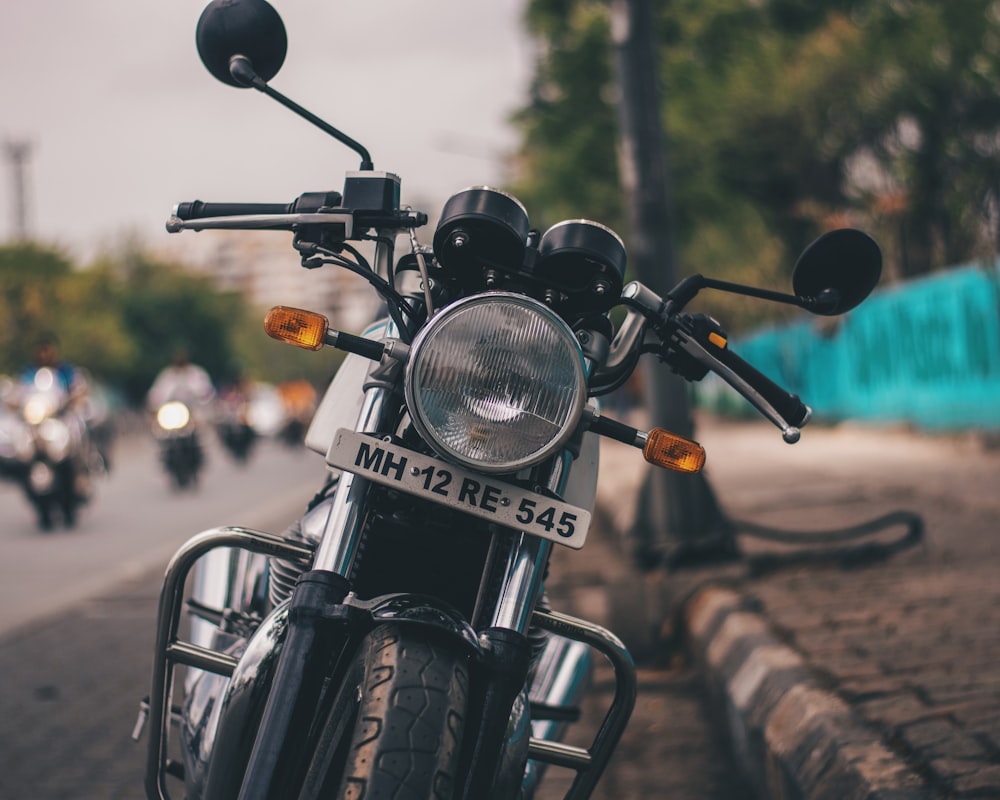 black motorcycle beside road