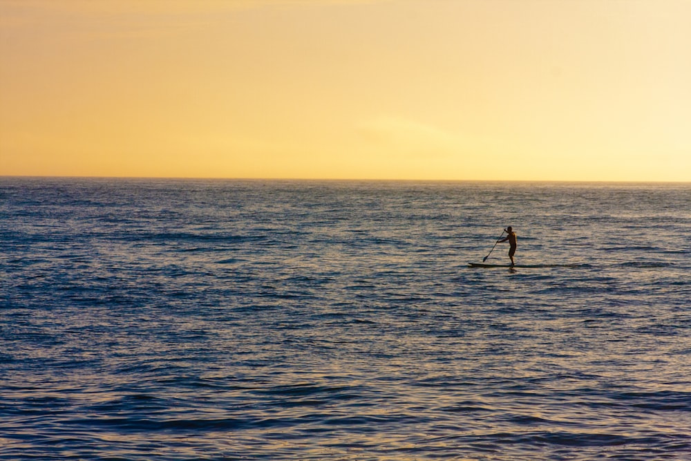 person riding on surfboard