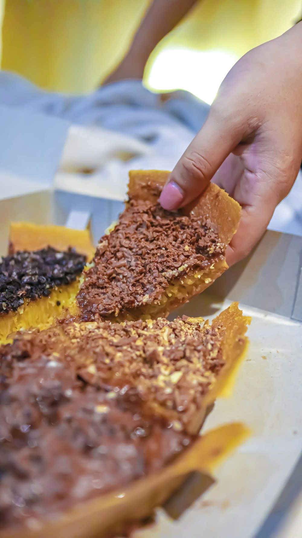 person picking sliced pie