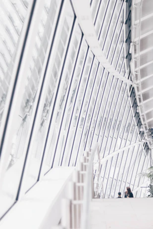 Modern living room with large windows and natural light showcasing sleek architectural design.