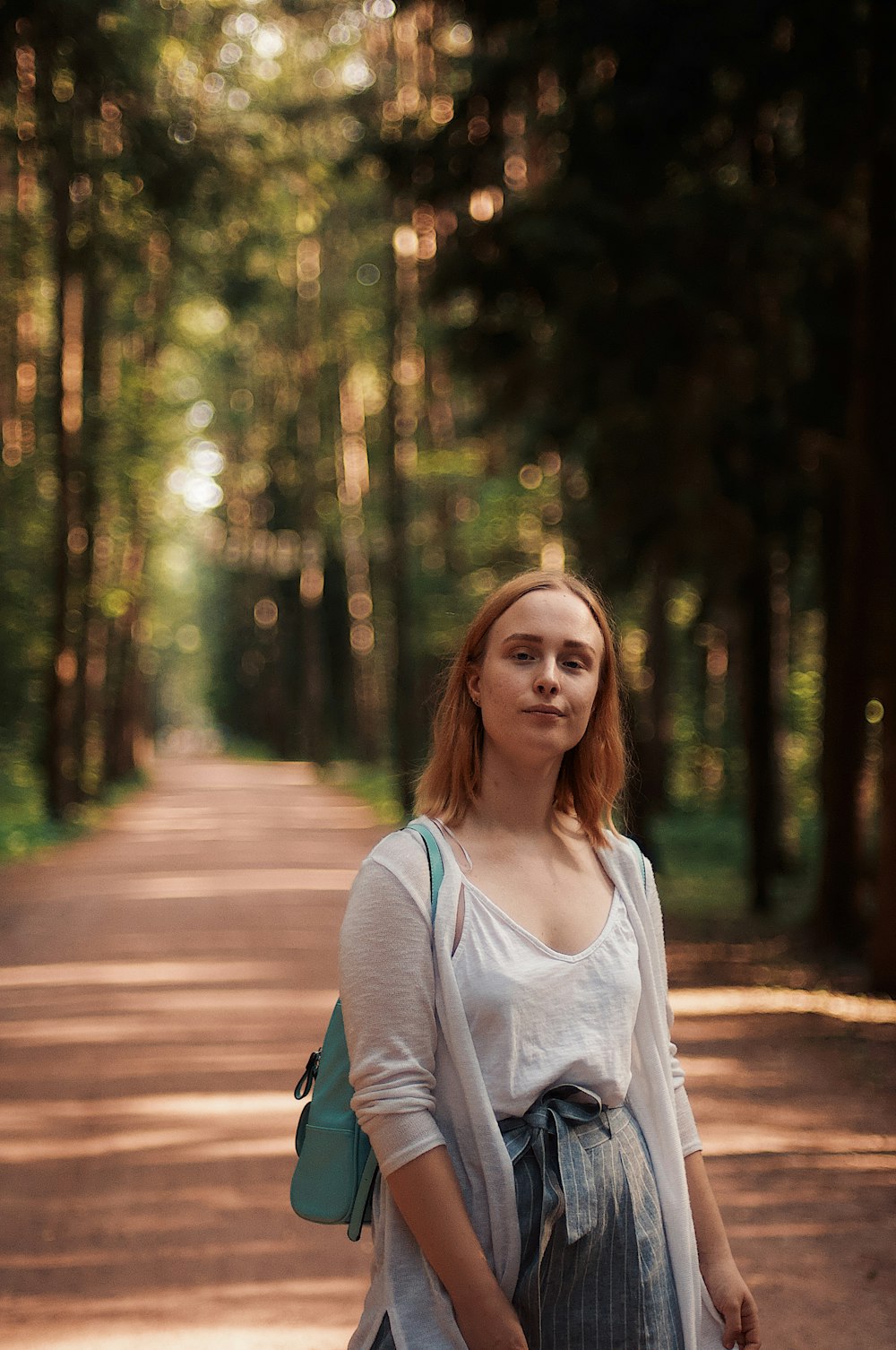 woman standing on pathway