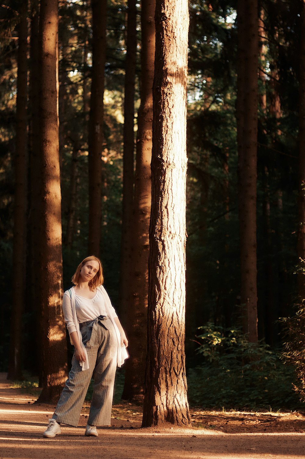 woman standing beside tree