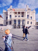 people beside white building during daytime