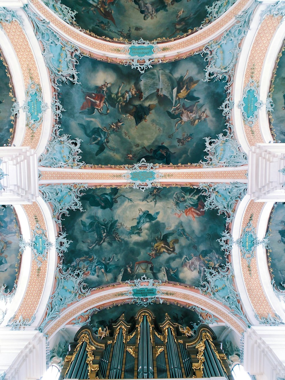 the ceiling of a church with a painting on it