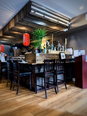 four brown wooden chairs