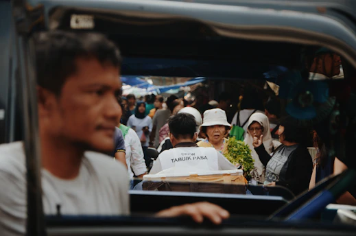 A bustling city street scene capturing everyday life and diverse people interacting.