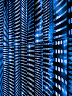 a wall that has a bunch of lights on it representing data storage