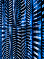 a wall that has a bunch of lights on it representing data storage