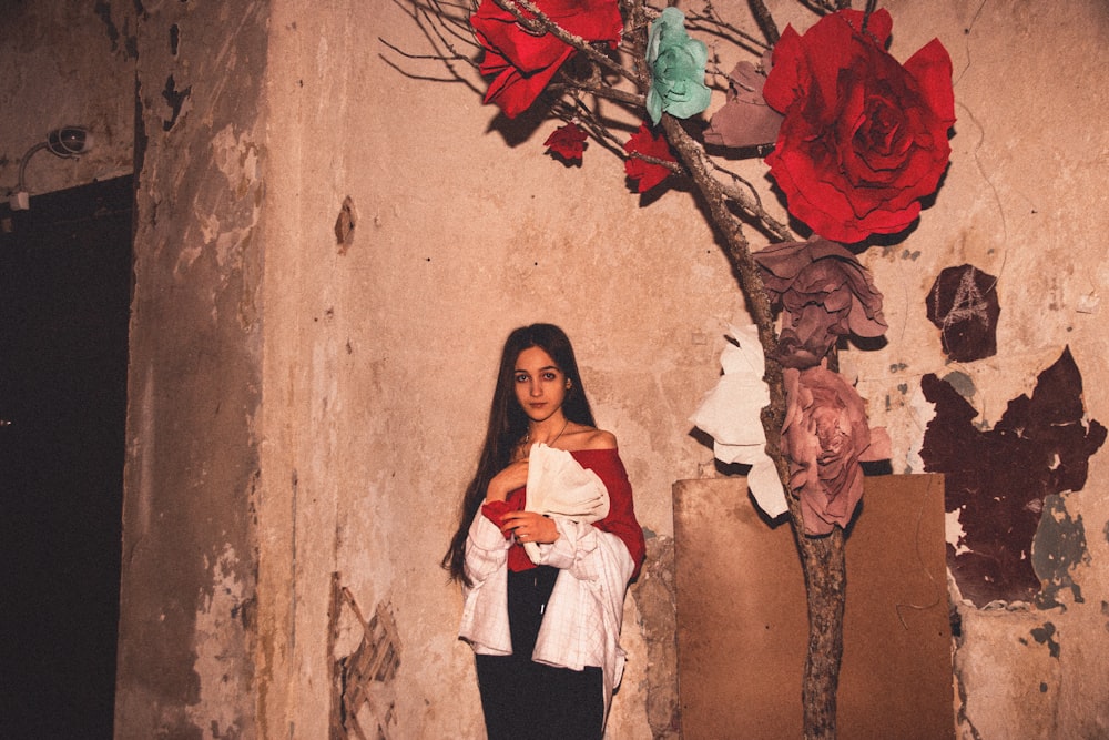 woman standing beside wall