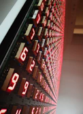 a large display of red numbers on a wall