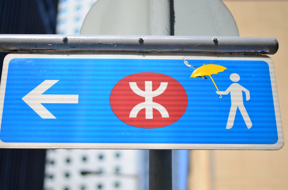 blue and white sign board close-up photography