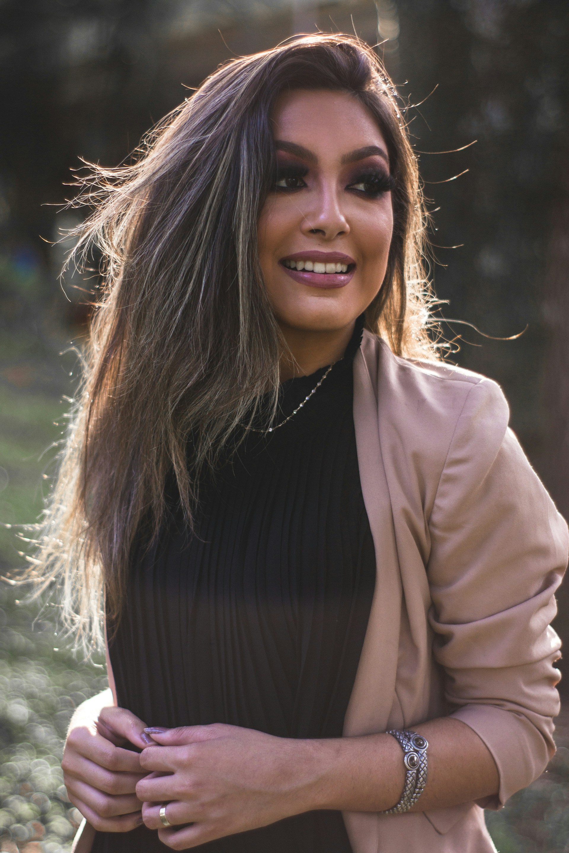woman wearing yellow long-sleeved dress under white clouds and blue sky during daytime