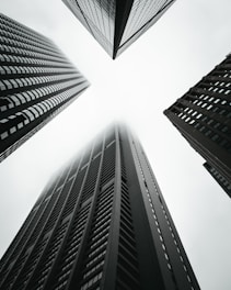 low angle photography of four high-rise buildings