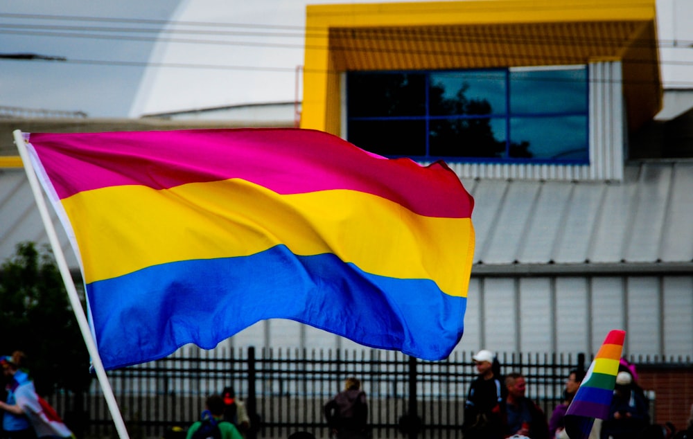 red, yellow, and white stripe flag