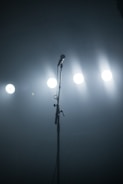 A lively stage with a microphone and spotlight.