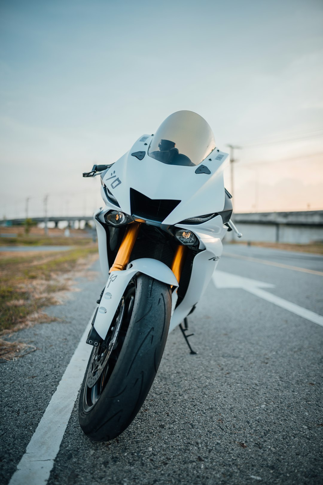 white Yamaha R6 parked at roadside