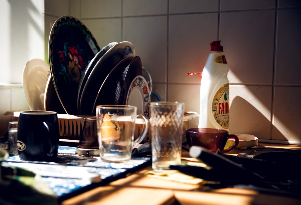 two empty drinking glass and mug