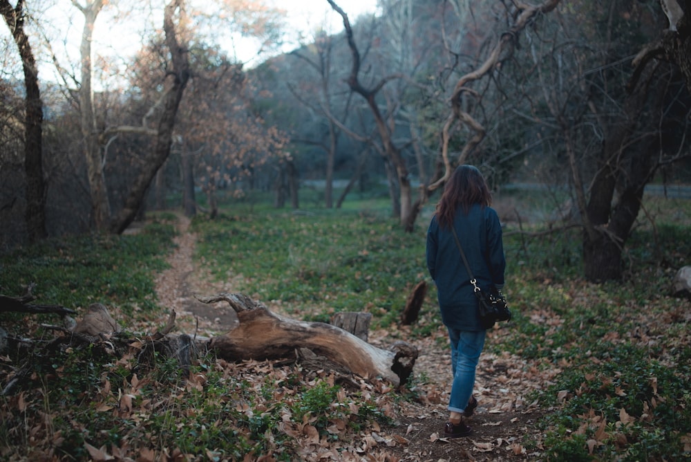 woman walking on forest