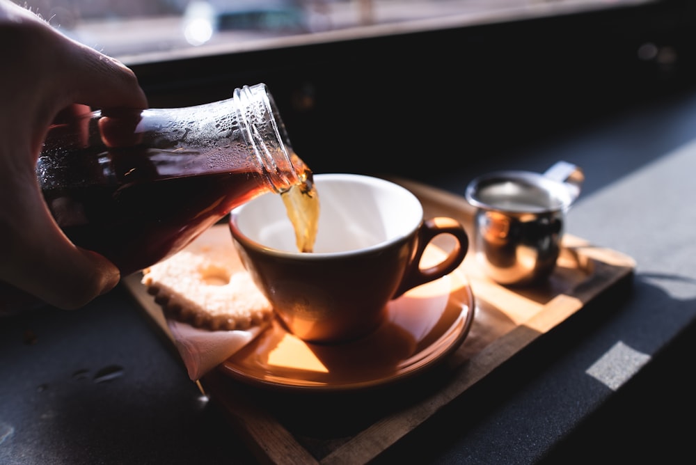 brown ceramic teacup