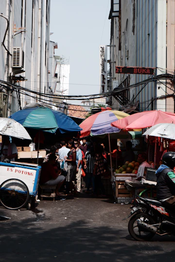 Street market with colourful umbrellas